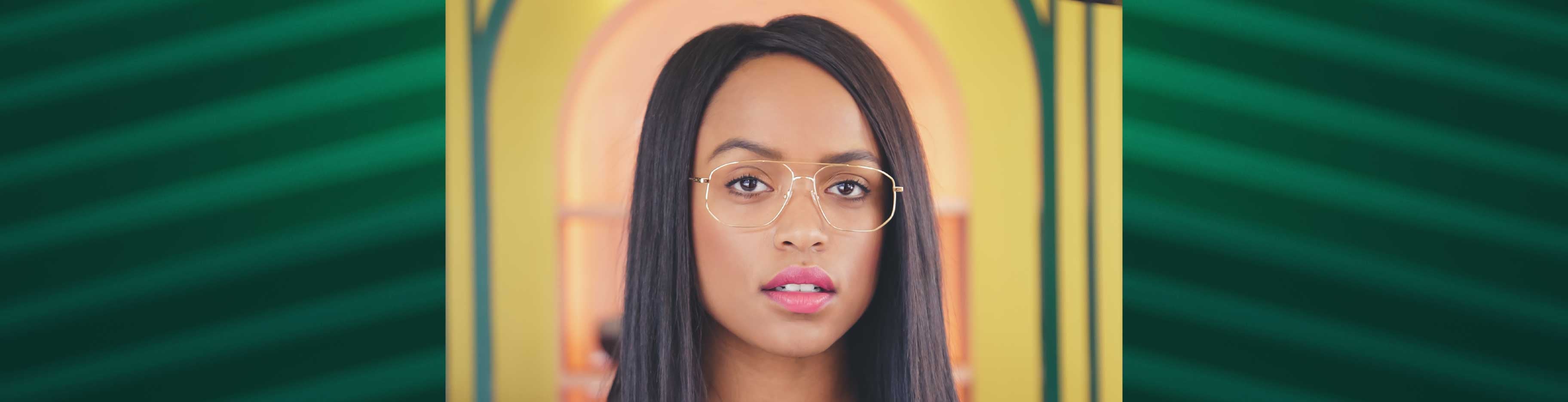 A young woman wearing Chloé CE2148 glasses