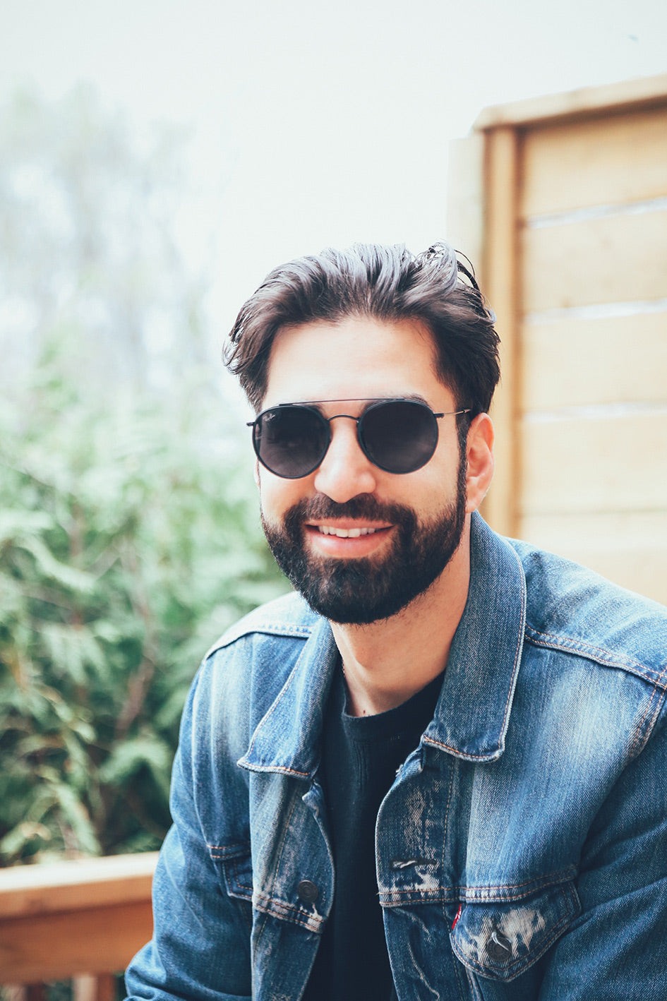 Men smiling wearing glasses