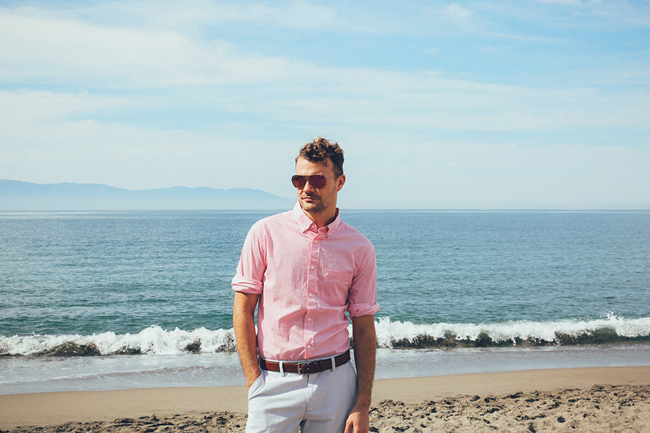 Men wearing glasses walking on the beach