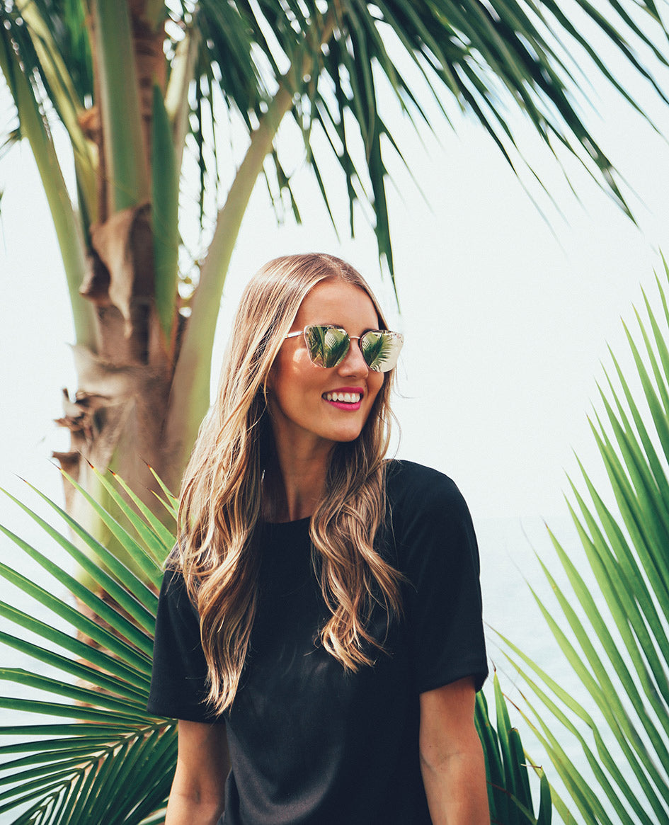 Photo shoot in Mexico with Bethany Menzel in front of a palm tree