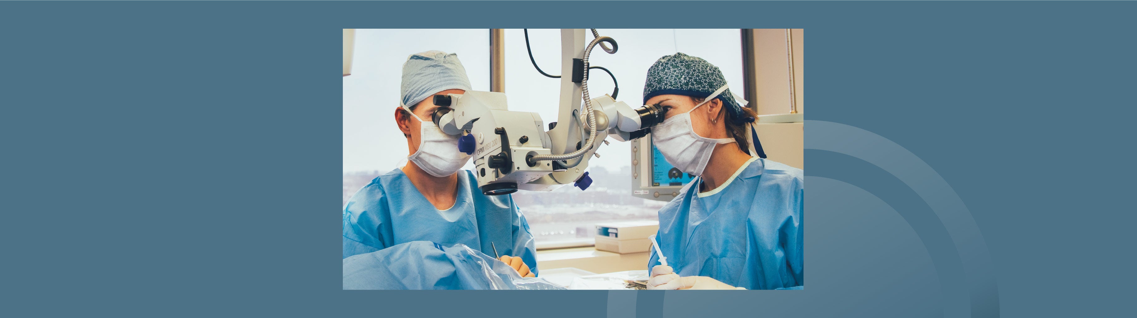 Two IRIS Ophthalmologist Performing Eye Surgery