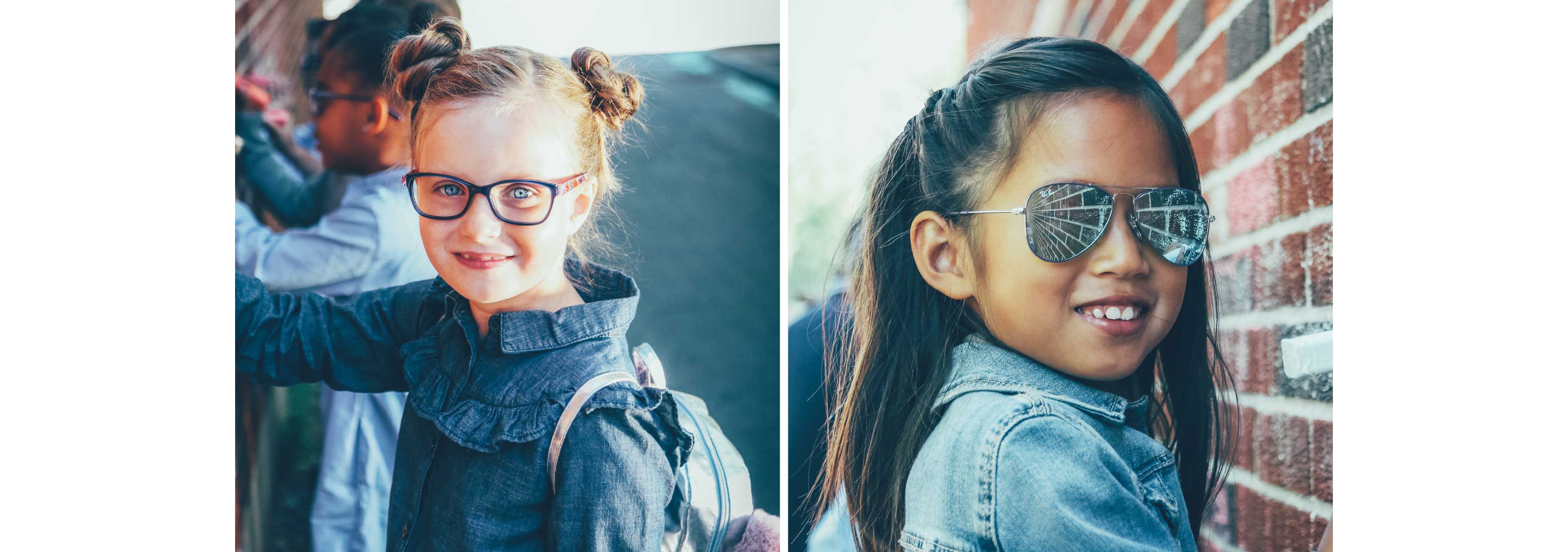 Two little girls are wearing glasses